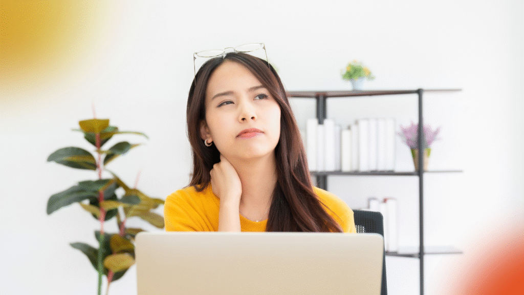 How to Successfully Become a Transaction Coordinator as a Career Change 1 woman in front of a laptop, thinking