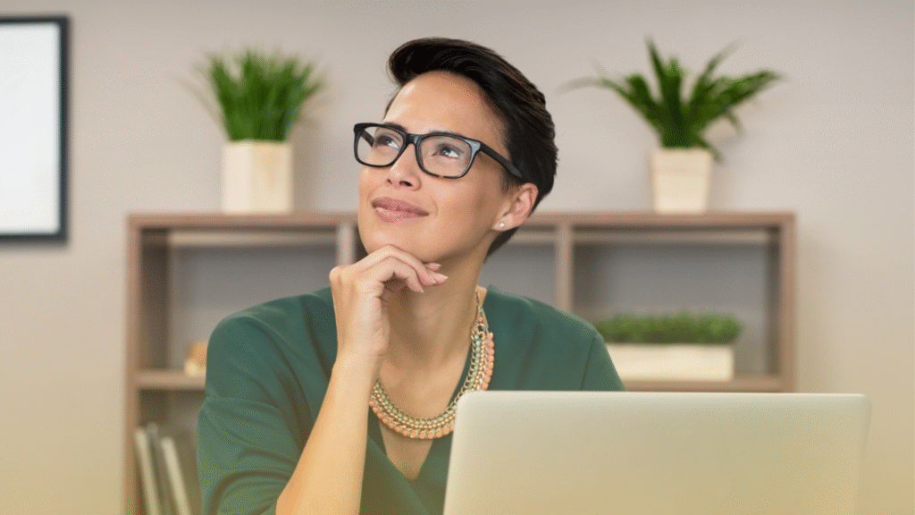 Is the Transaction Coordinator (TC) Role Right for You? 1 woman sitting in front of laptop thinking